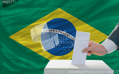 Image of man voting on elections in brazil