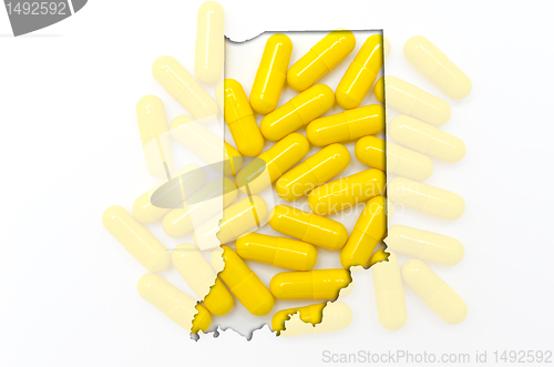 Image of Outline map of Indiana with transparent pills in the background