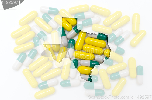 Image of Outline map of texas with transparent pills in the background