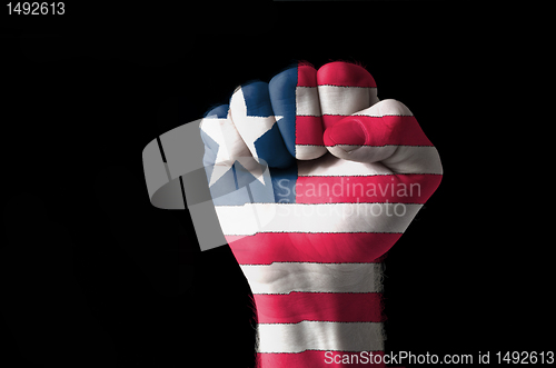 Image of Fist painted in colors of liberia flag