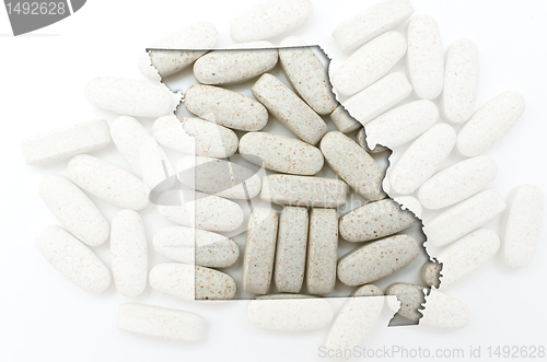Image of Outline map of missouri with transparent pills in the background