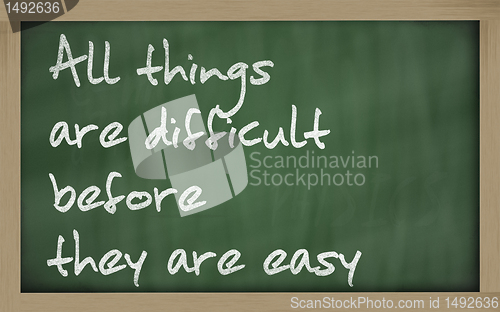 Image of " All things are difficult before they are easy " written on a b