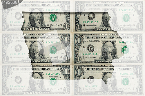 Image of Outline map of Iowa with transparent american dollar banknotes i