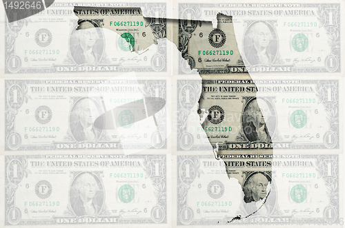 Image of Outline map of Florida with transparent american dollar banknote