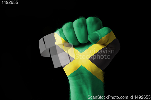 Image of Fist painted in colors of jamaica flag