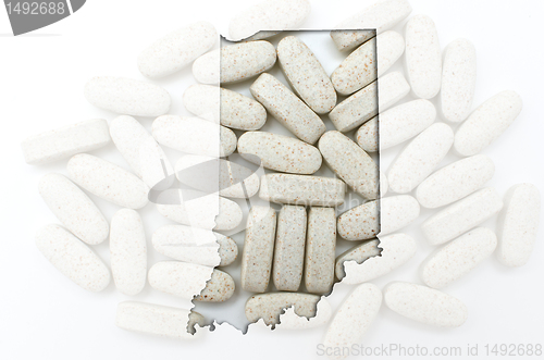 Image of Outline map of Indiana with transparent pills in the background