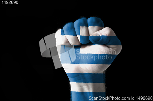 Image of Fist painted in colors of greece flag