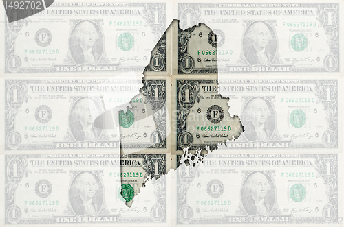 Image of Outline map of maine with transparent american dollar banknotes 