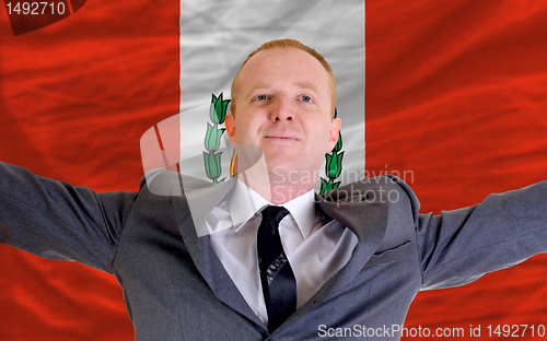 Image of happy businessman because of profitable investment in peru stand