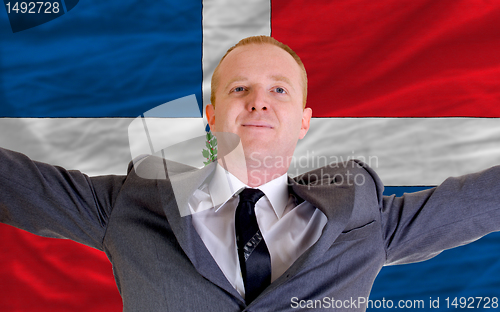 Image of happy businessman because of profitable investment in dominican 