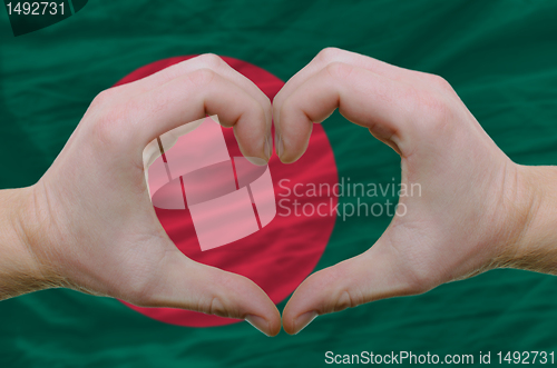 Image of Heart and love gesture showed by hands over flag of bamgladesh b