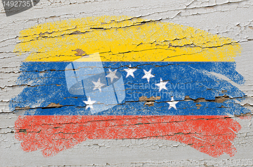 Image of flag of venezuela on grunge wooden texture painted with chalk  