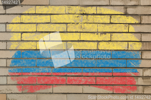 Image of flag of Columbia on grunge brick wall painted with chalk  