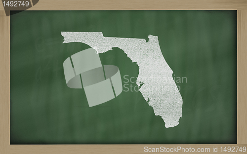 Image of outline map of florida on blackboard 