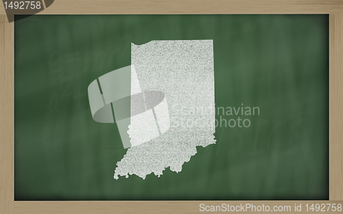 Image of outline map of indiana on blackboard 