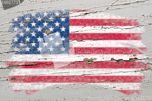 Image of flag of USA on grunge wooden texture painted with chalk  