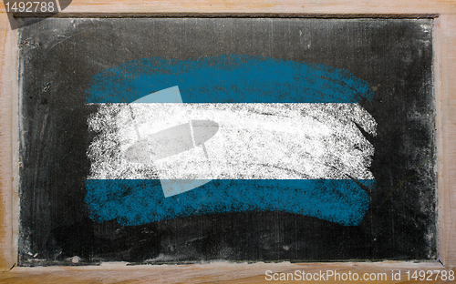 Image of flag of El Salvador on blackboard painted with chalk  