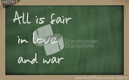 Image of " All is fair in love and war " written on a blackboard