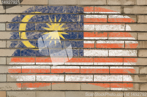 Image of flag of malaysia on grunge brick wall painted with chalk  