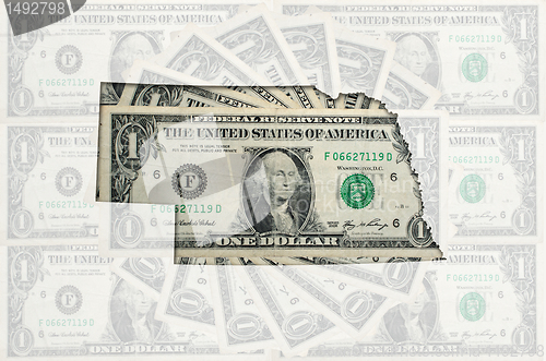 Image of Outline map of nebraska with transparent american dollar banknot