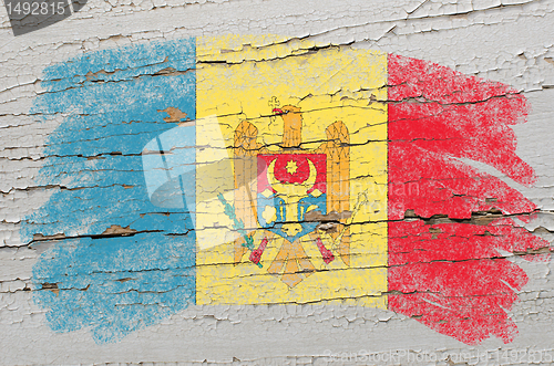 Image of flag of moldova on grunge wooden texture painted with chalk  