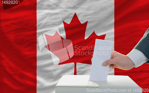 Image of man voting on elections in canada