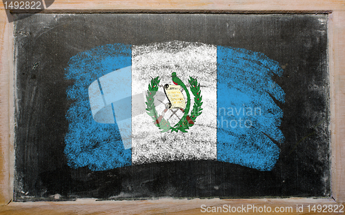 Image of flag of Guatemala on blackboard painted with chalk  