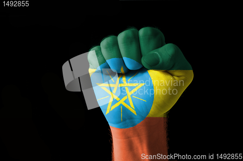 Image of Fist painted in colors of ethiopia flag