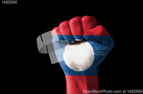 Image of Fist painted in colors of laos flag