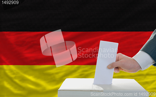 Image of man voting on elections in germany