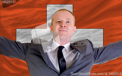 Image of happy businessman because of profitable investment in swiss stan