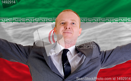 Image of happy businessman because of profitable investment in iran stand