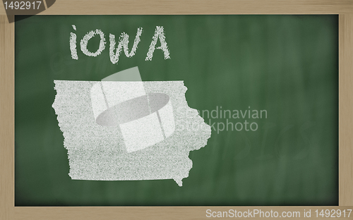 Image of outline map of iowa on blackboard 