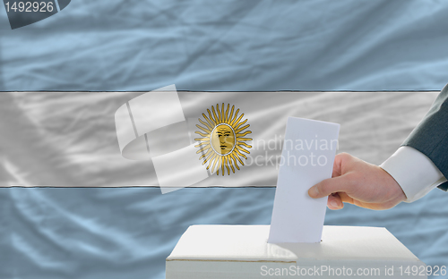 Image of man voting on elections in argentina