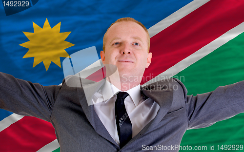 Image of happy businessman because of profitable investment in namibia st