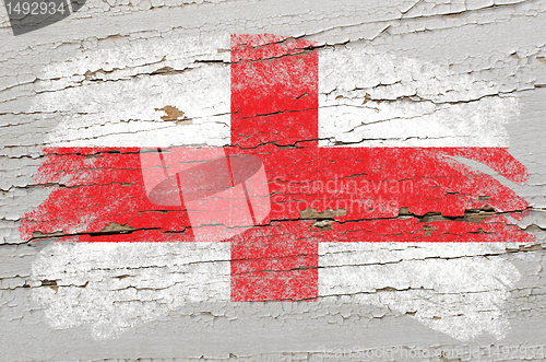 Image of flag of england on grunge wooden texture painted with chalk  