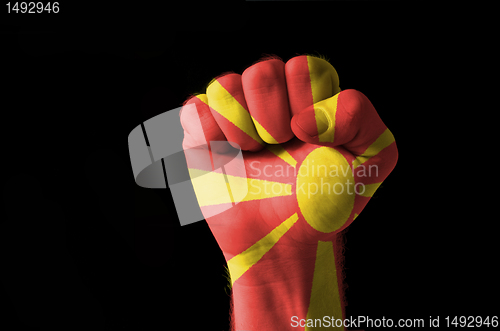 Image of Fist painted in colors of macedonia flag