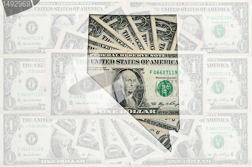 Image of Outline map of nevada with transparent american dollar banknotes