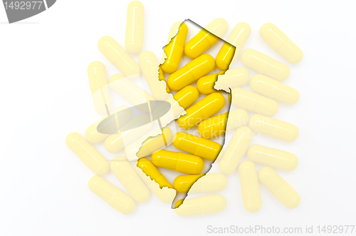 Image of Outline map of new jersey with transparent pills in the backgrou