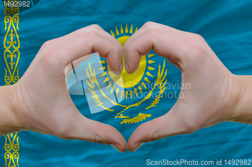 Image of Heart and love gesture showed by hands over flag of kazakstan ba