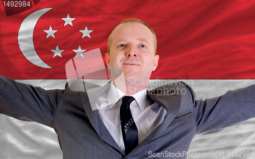 Image of happy businessman because of profitable investment in singapore 