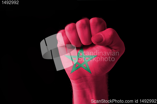 Image of Fist painted in colors of morocco flag