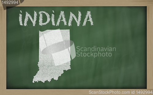 Image of outline map of indiana on blackboard 