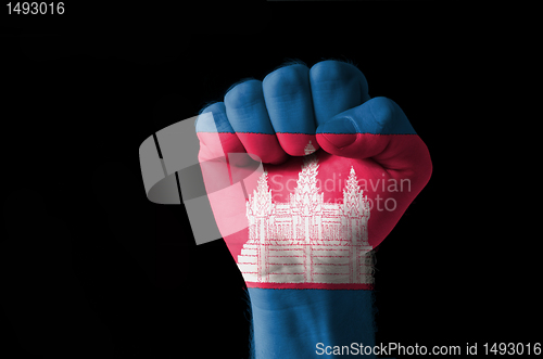 Image of Fist painted in colors of cambodia flag