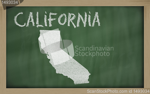 Image of outline map of california on blackboard 