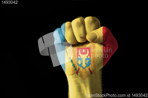 Image of Fist painted in colors of moldova flag