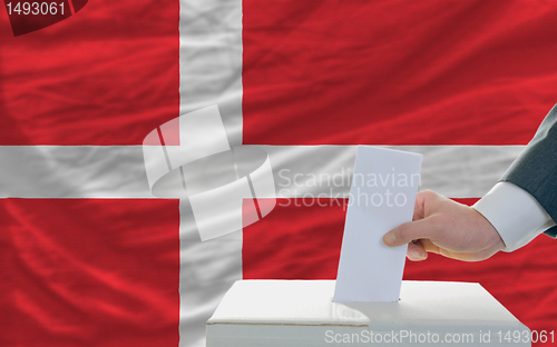 Image of man voting on elections in denmark