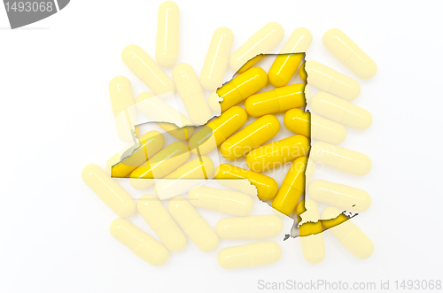 Image of Outline map of new york with transparent pills in the background