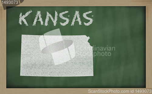 Image of outline map of kansas on blackboard 