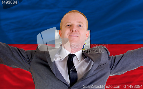 Image of happy businessman because of profitable investment in haiti stan